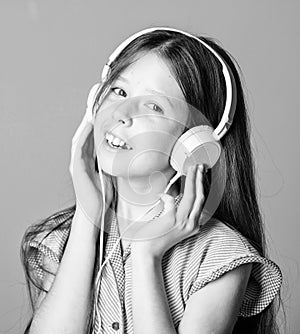 Audio book. Educative content. Study english language with audio lessons. Girl listen music modern headphones gadget