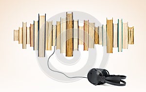 Audio books concept, sound wave from paper books, headphones connected below. On light yellow