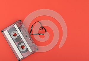 Audio cassette tape on red backgound