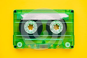 Audio cassette tape on yellow background