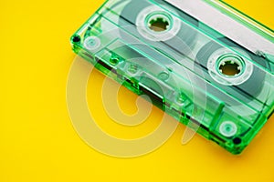 Audio cassette tape on yellow background