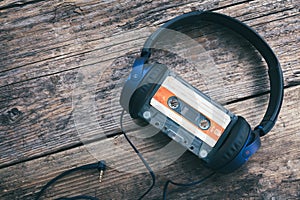 Audio compact cassette tape and headphones background