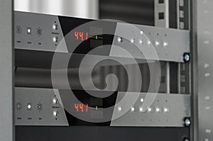 Audio converters mounted on a rack.