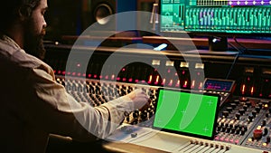 Audio expert mixing and mastering tunes on editing software