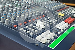 Audio mixer mixing board fader and knobs. Selective focus