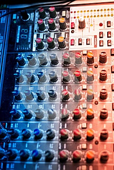 An Audio mixing table in soft light