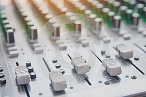 Audio sound mixer control panel.  Sound console buttons for adjust the volume