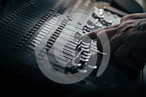 audio sound mixer controller at studio in dark background
