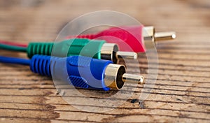 audio video analog cable on old wood background, red ,green ,blue color concept