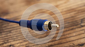 audio-video analog cable  on an old wood table background