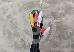 Audio video cable RCA to 3.5mm jack. RCA cable connector, RCA connector on floor Background, Red white Yellow connector Jack,