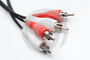 Audio and video cables on white background