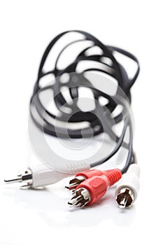 Audio and video cables on white background