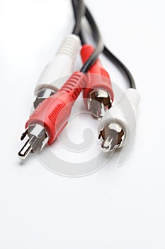 Audio and video cables on white background