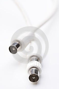 Audio and video cables on white background