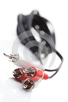 Audio and video cables on white background