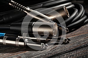 audio xlr trs cable plugs on wood