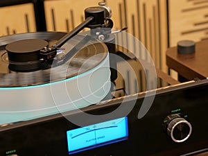 Audiophile turntable with vinyl record.