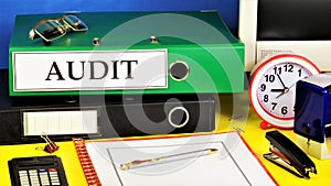 Audit - the text label for the folder office of the Registrar. photo