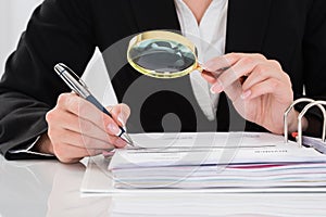 Auditor Inspecting Financial Documents