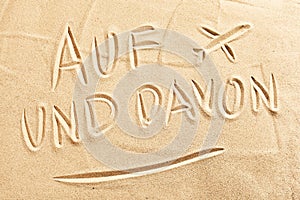 Auf und Davon with airplane on beach sand