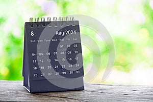 Aug 2024 table calendar with nature background. Calendar and month concept