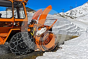 Auger and discharge chutes of a snow blower photo
