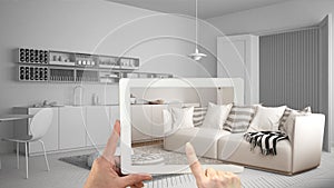 Augmented reality concept. Hand holding tablet with AR application used to simulate furniture and interior design products in real photo