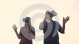 Augmented teamwork future reality device creating virtual space concept slow motion video. Lifestyle man and girl in