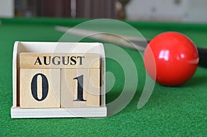 August 01, number cube on snooker table, sport background.