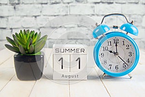 August 11 on the wooden calendar.The eleventh day of the summer month, a calendar for the workplace. Summer