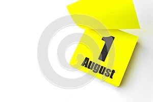 August 1st . Day 1 of month, Calendar date. Close-Up Blank Yellow paper reminder sticky note on White Background. Summer month,