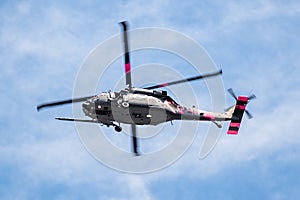 August 13, 2020 Mountain View / CA / USA -  Military helicopter with pink markings in mid flight; California National Guard HH-60