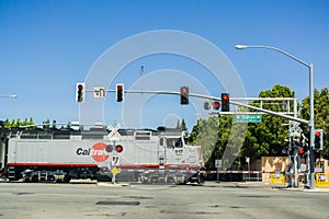 August 30, 2017 Sunnyvale/CA/USA - Caltrain crossing at a street junction near a residential neighborhood in south San Francisco