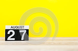 August 27th. Image of august 27, calendar on yellow background with empty space for text. Summer time photo