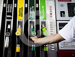 Fuel pump station close up of diesel and gasoline nozzles pumps