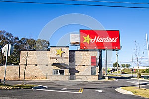 Hardees Fast Food Restaurant billboard sign and building side view