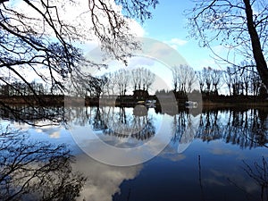 Aukstumalos river, home and trees, Lithuania