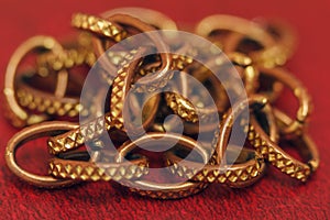 Aureate chain close-up on a red background photo