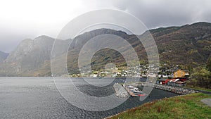 Aurland town and misty mountains in the Aurlandsfjord  in South Norway