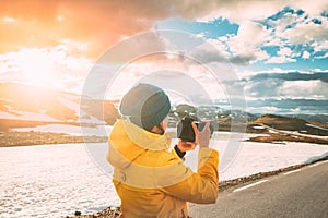 Aurlandsfjellet, Norway. Young Happy Woman Tourist Traveler Photographer Taking Pictures Photos Of Aurlandsfjellet