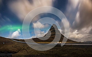 Aurora blasted in sky over Kirkjufell mountain at night, Iceland photo