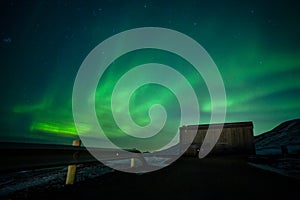 Aurora borealis above the watertank in Longyearbyen