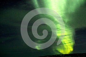 Aurora Borealis on a cloudy night photo