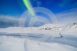 Aurora borealis on the Lofoten islands, Norway. Northern Lights over the mountains. Scandinavia.