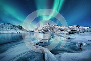 Aurora Borealis, Lofoten islands, Norway. Nothen light, mountains and ocean. Winter landscape at the night time.