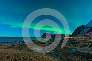 Aurora borealis or northern light over Uttakleiv beach at night in Lofoten island, Nordland Norway, Scandinavia