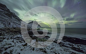 Aurora Borealis Northern Lights above Mountains in Iceland