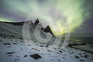 Aurora Borealis Northern Lights above Mountains in Iceland