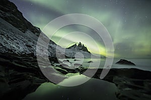 Aurora Borealis Northern Lights above Mountains in Iceland